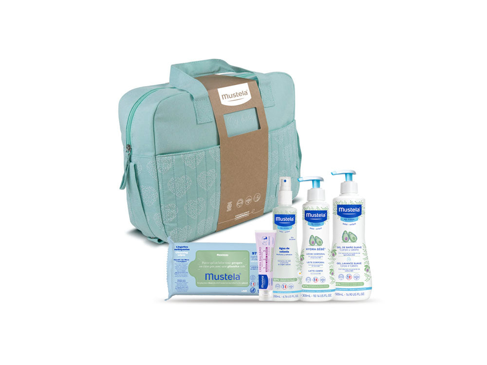 Bolsa de paseo color menta con productos para la higiene corporal de tu bebé Mustela