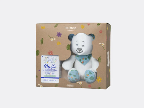 Caja del cofre de regalo Musti Mixto color verde menta que contiene la colonia de bebé Eau de Soin y el peluche de osito de Mustela en color blanco.