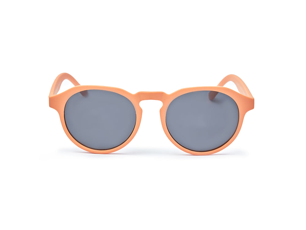 Gafas de sol de adulto en color coral y forma redonda, hechas con materiales reciclados y con cristal polarizado de categoría 3 y protección UV400.