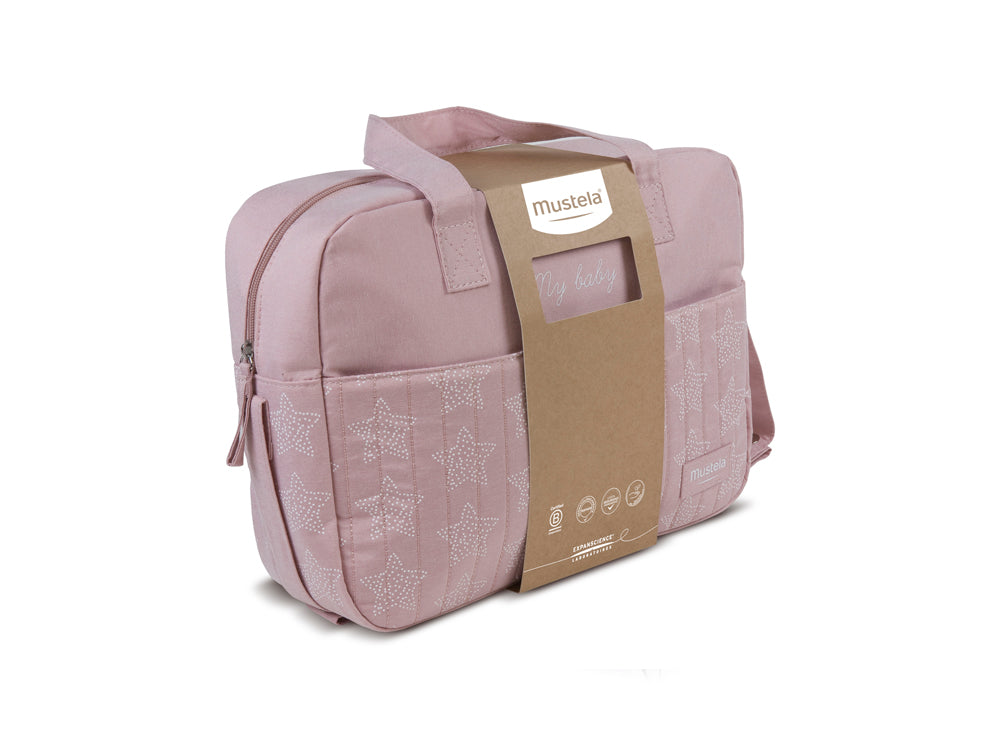 Bolsa de paseo Mustela de color rosa “Mis primeros pasos” que incluye productos de cuidado para recién nacidos, ideal para regalar